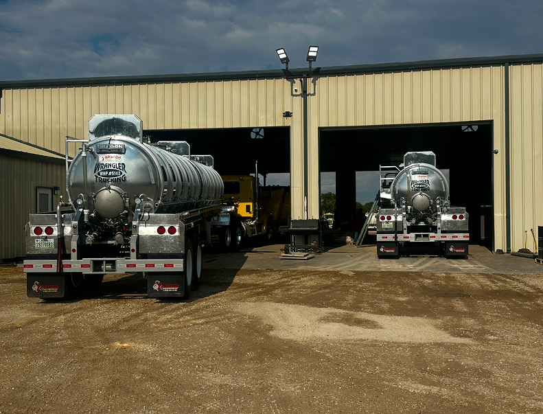 Tanker trucks parked at industrial building
